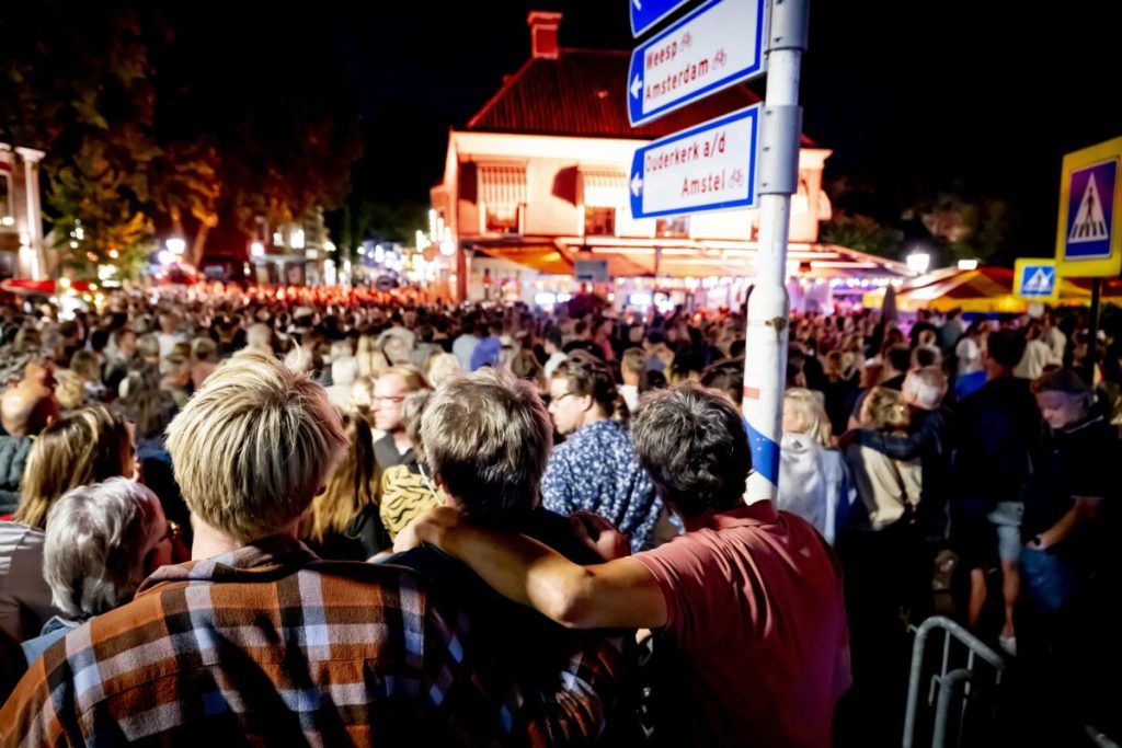 Buildings in Amsterdam lit up orange following murder of Lisa