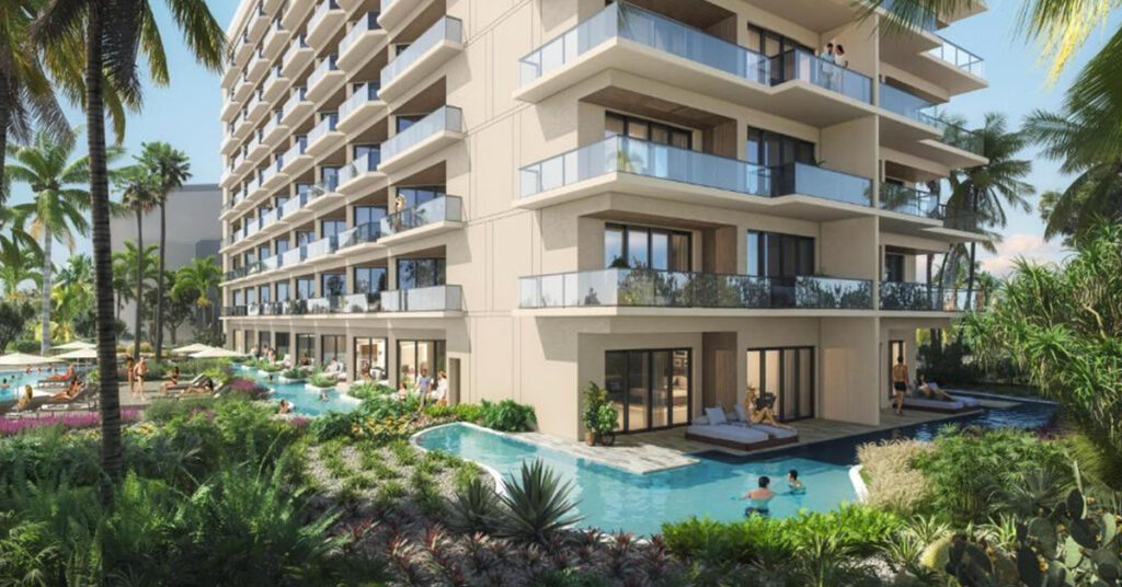 This New Hilton Tower in Aruba Has Adults-Only Swim-Up Rooms, a Rooftop Lounge, and Palm Beach Views